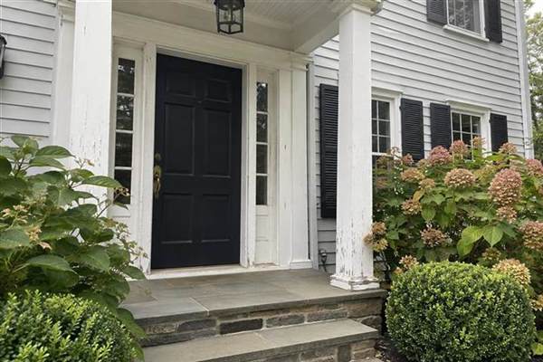 Weathered exterior trim on a Connecticut home entry